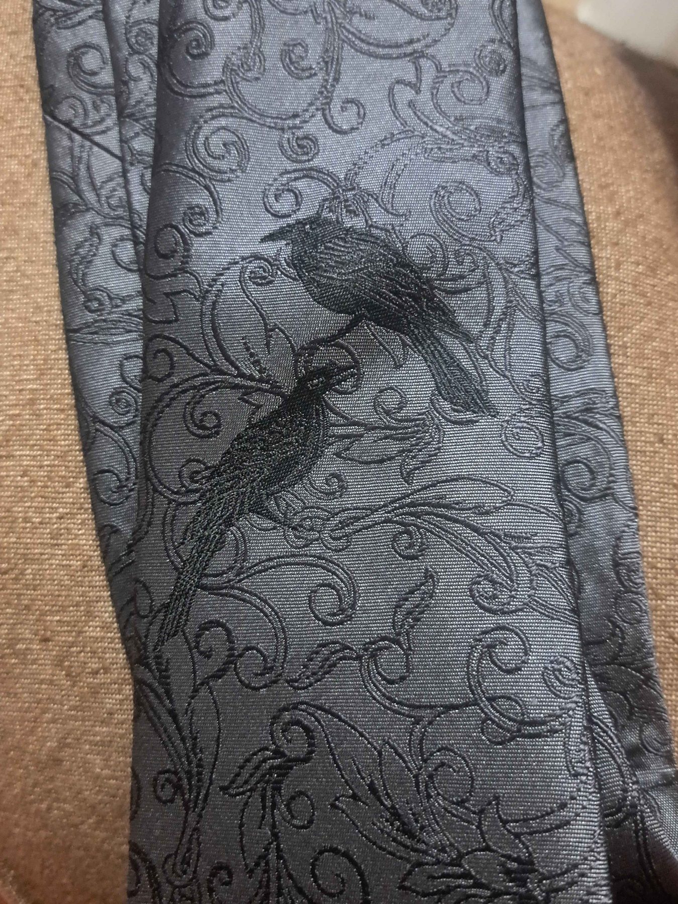 Close detail of ravens in the silk scroll pattern