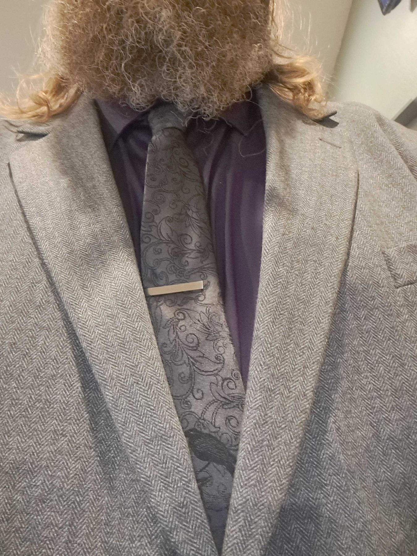 Prototype necktie with herringbone blazer and tie bar